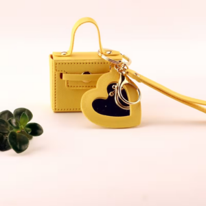 A Mini Square Bag with a Heart-Shaped Makeup Mirror